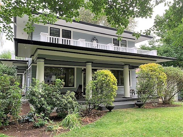 Painted home with a wide front porch