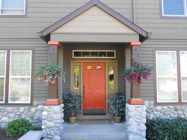 Painted home entry with a red door
