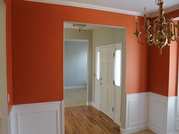 Dining room painted in warm orange